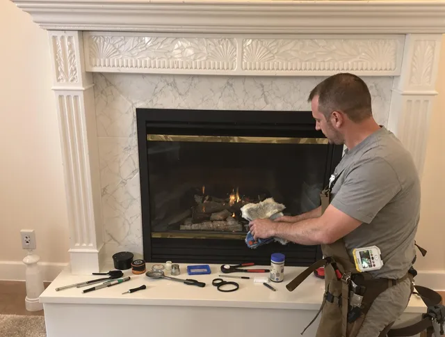 Milford city  Chimney Sweep performing fireplace maintenance in Milford city , CT